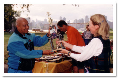Subarata receives a smile and a trophy from Sri Chinmoy
